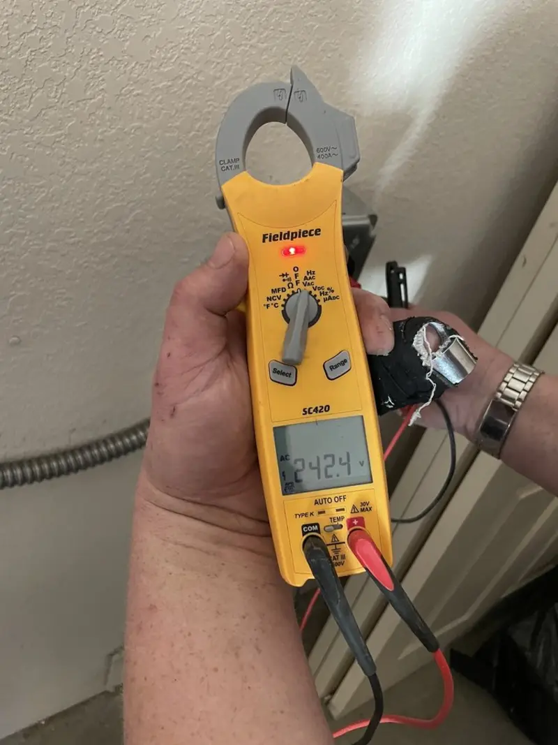 Voltage testing with clamp meter during Generator Installation in Hobart